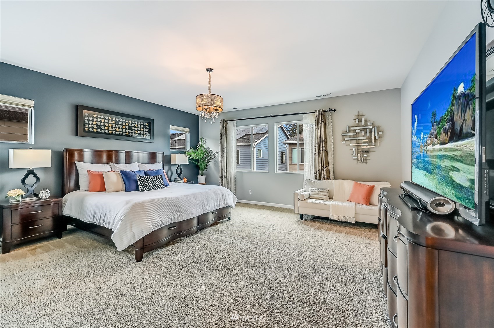 3715 195th Place Southeast Bothell, WA 98012 - Photo 16 of 28 a spacious bedroom with a bed and glass window