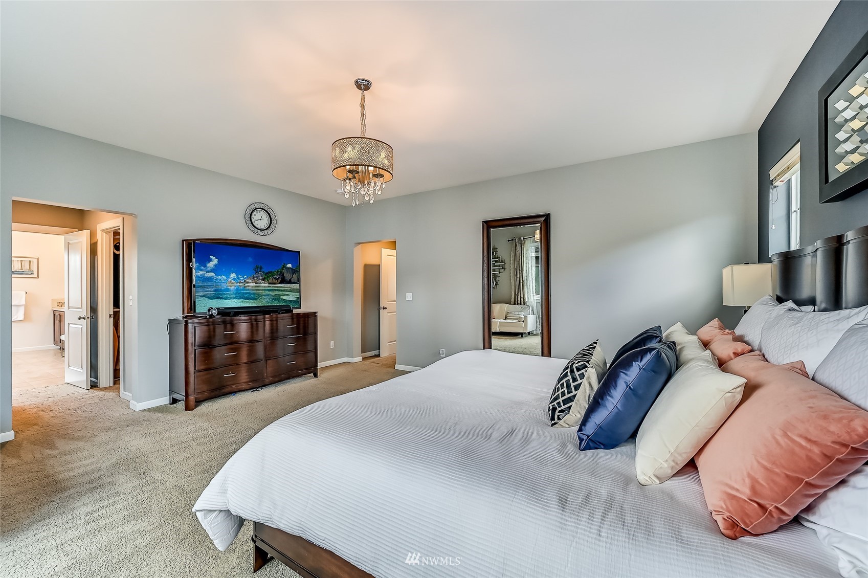 3715 195th Place Southeast Bothell, WA 98012 - Photo 18 of 28 a bedroom with a bed and a flat screen tv
