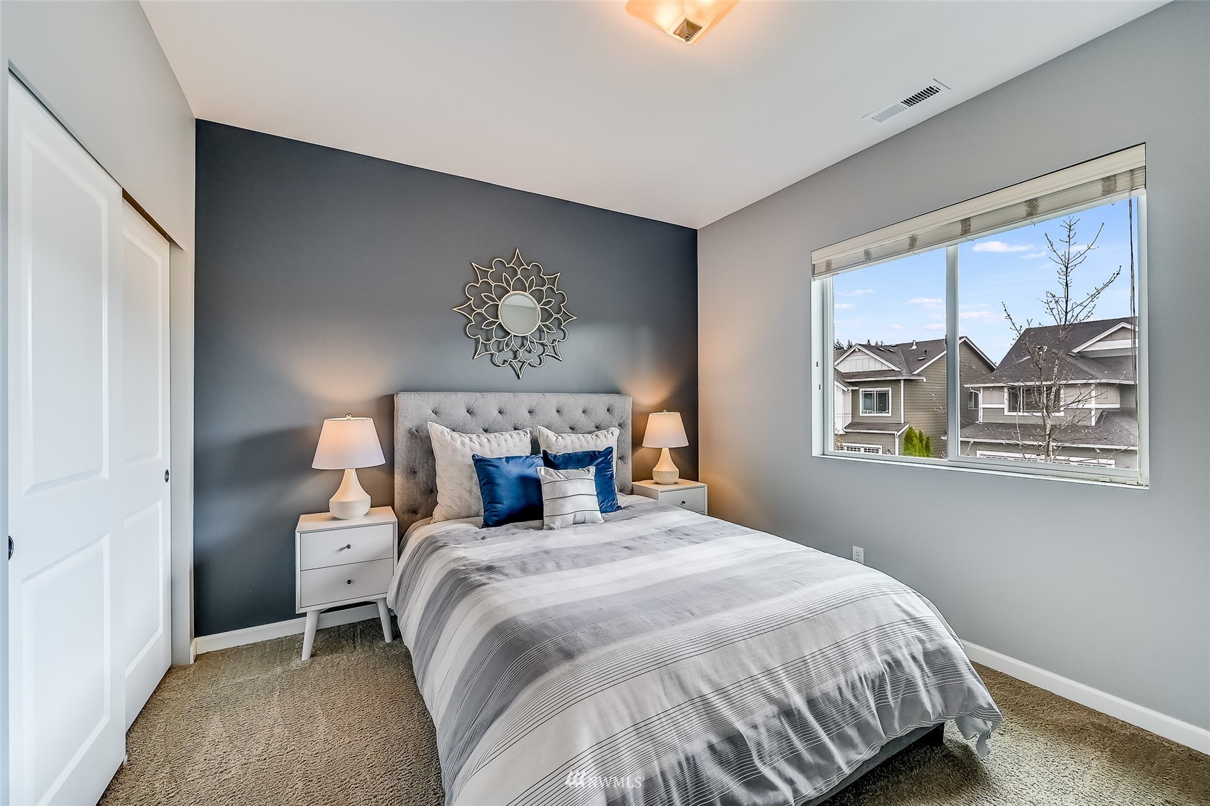 3715 195th Place Southeast Bothell, WA 98012 - Photo 19 of 28 a bedroom with a bed and painting on the wall