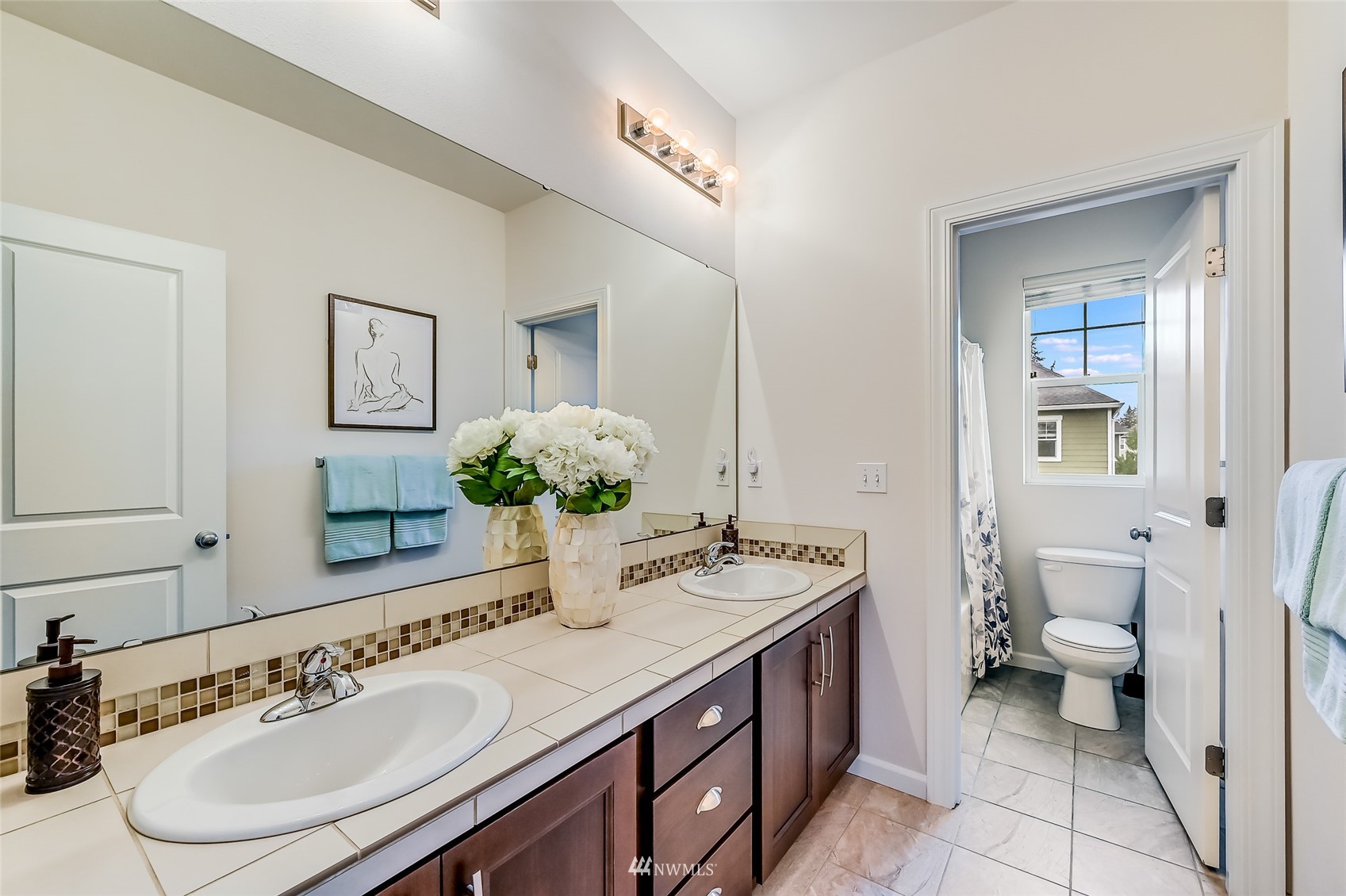 3715 195th Place Southeast Bothell, WA 98012 - Photo 21 of 28 a bathroom with a granite countertop sink a toilet and a mirror