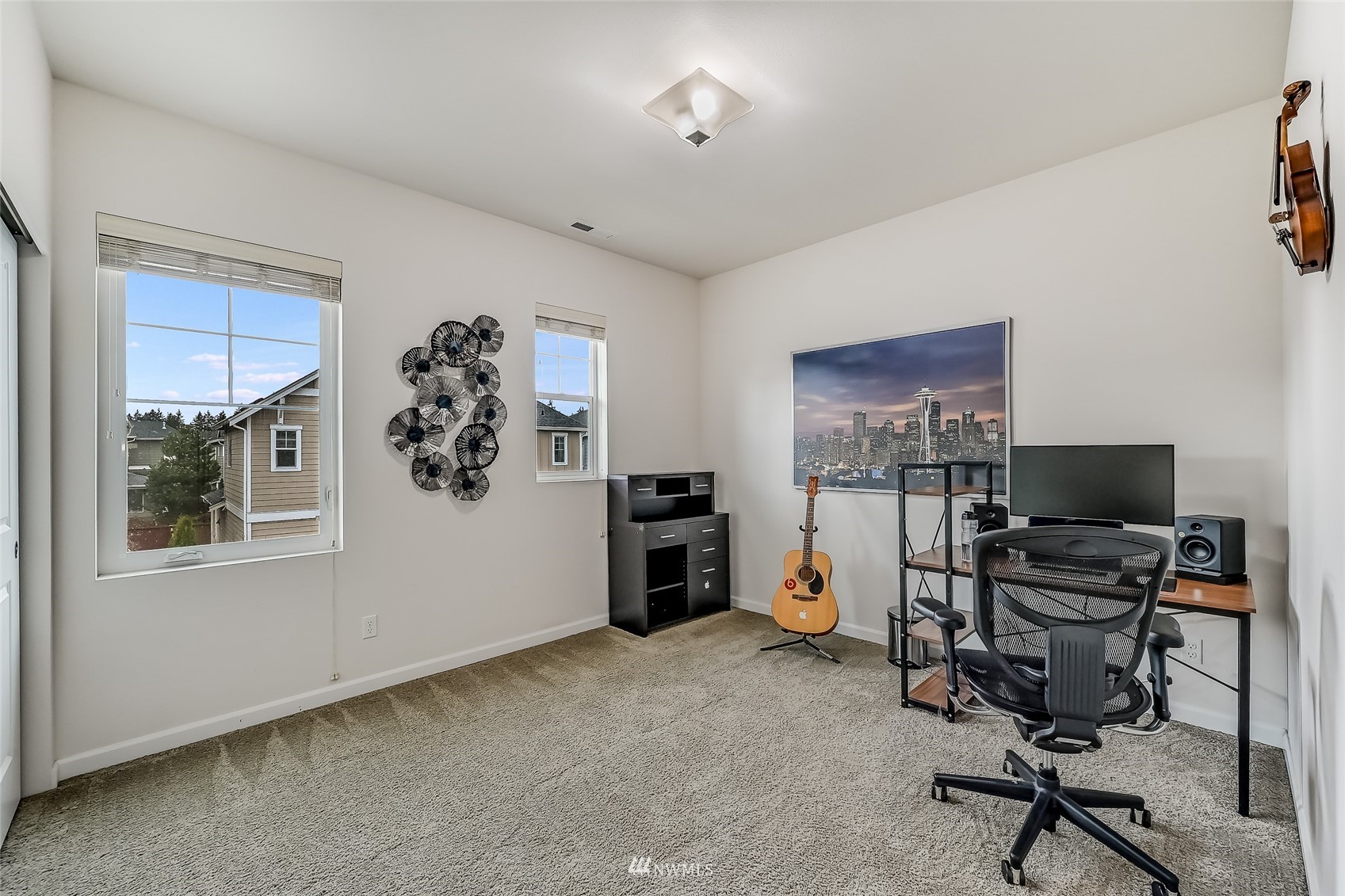 3715 195th Place Southeast Bothell, WA 98012 - Photo 23 of 28 a view of a workspace with furniture and a window