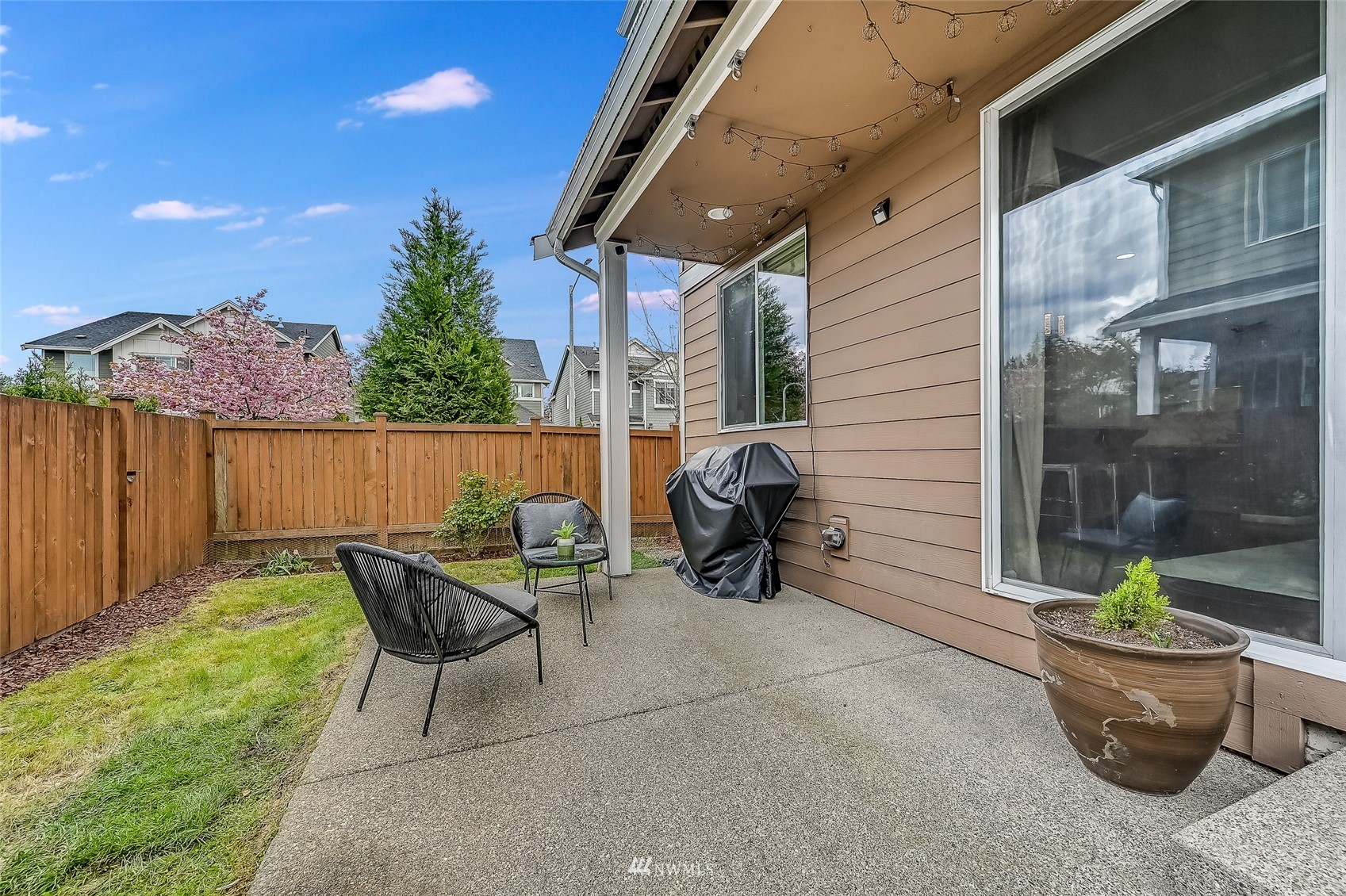 3715 195th Place Southeast Bothell, WA 98012 - Photo 27 of 28 a view of a patio with table and chairs and potted plants