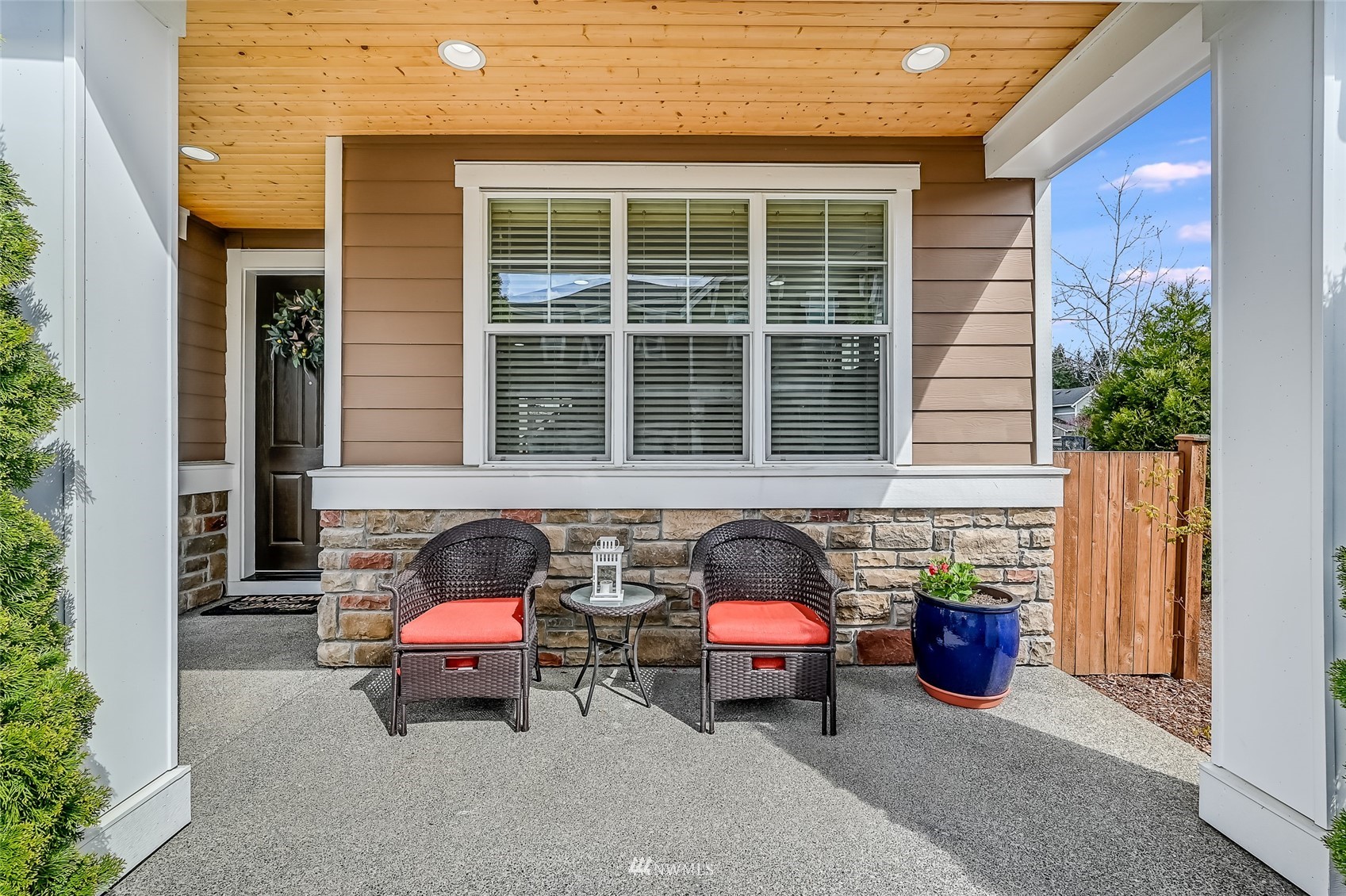 3715 195th Place Southeast Bothell, WA 98012 - Photo 3 of 28 a view of a patio with table and chairs and potted plants