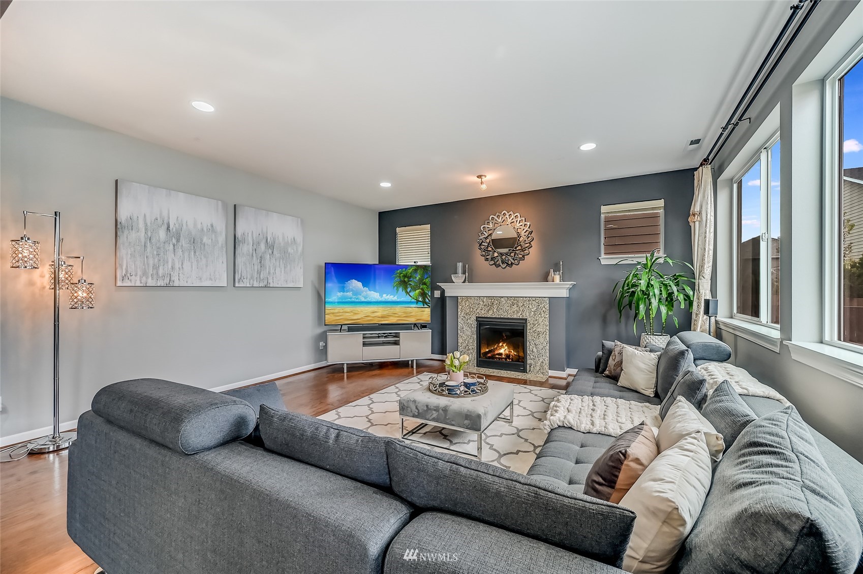 3715 195th Place Southeast Bothell, WA 98012 - Photo 6 of 28 a living room with furniture fireplace and a large window