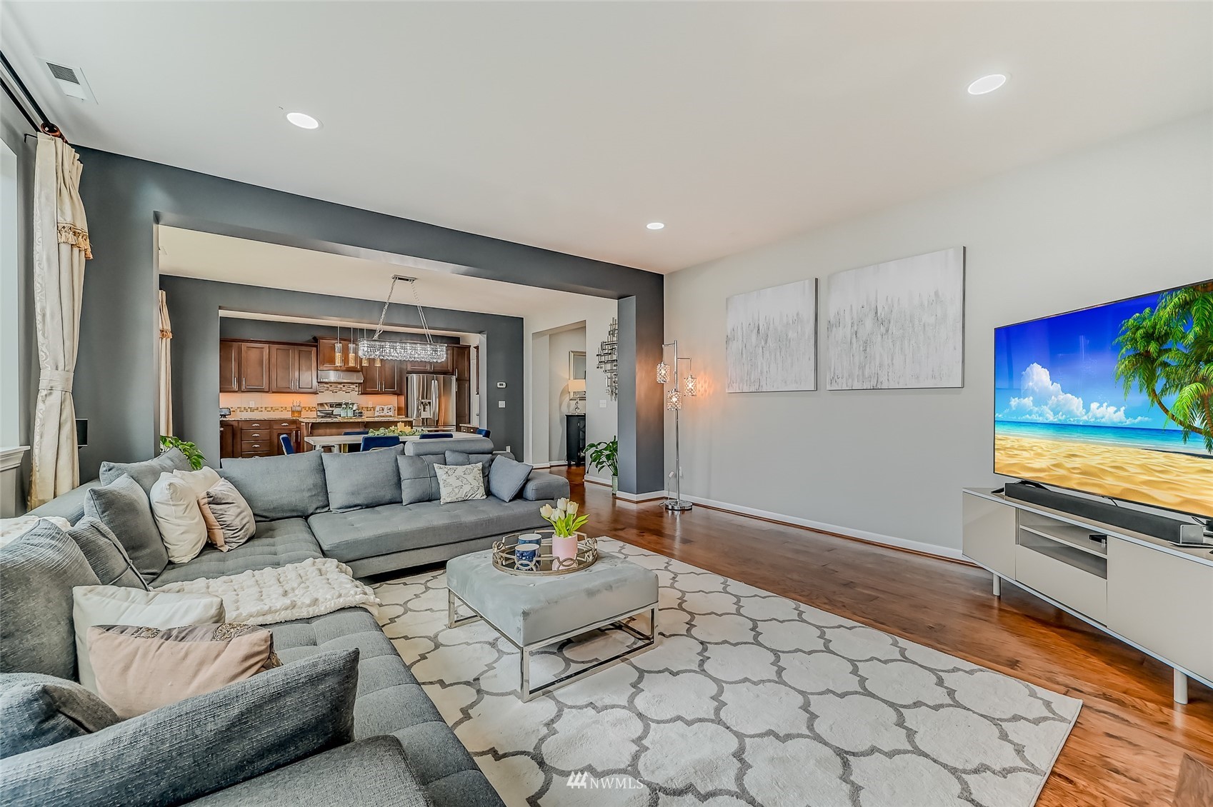 3715 195th Place Southeast Bothell, WA 98012 - Photo 7 of 28 a living room with furniture and a flat screen tv
