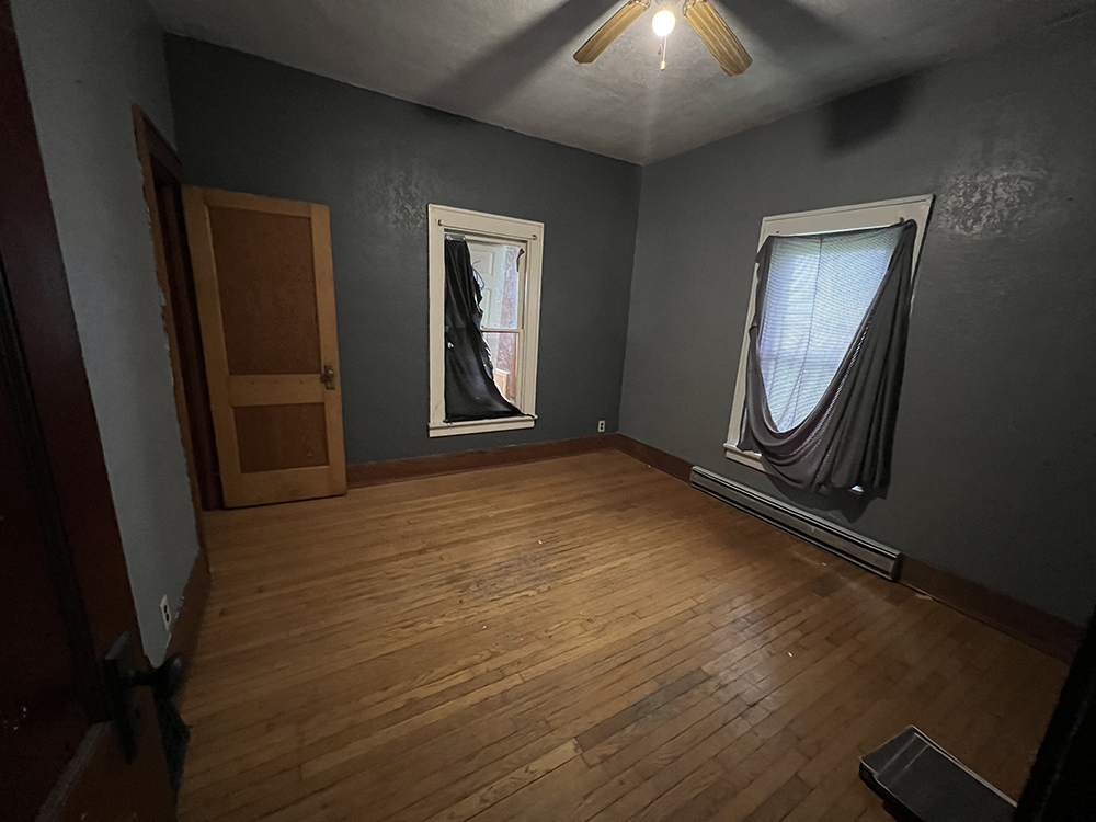 20069 Capp Road Morrison, IL 61270 - Photo 17 of 22 a view of an empty room with wooden floor and a window