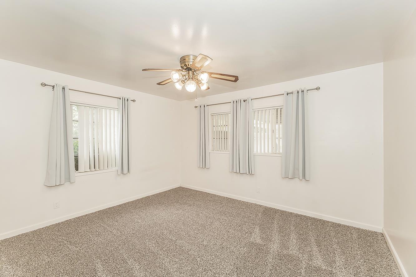 795 West Palm Avenue Reedley, CA 93654 - Photo 9 of 28 a view of an empty room with a window
