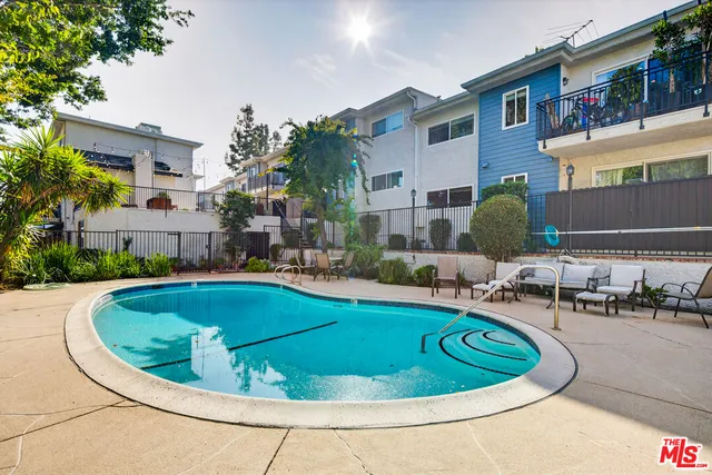 a view of a swimming pool with a patio