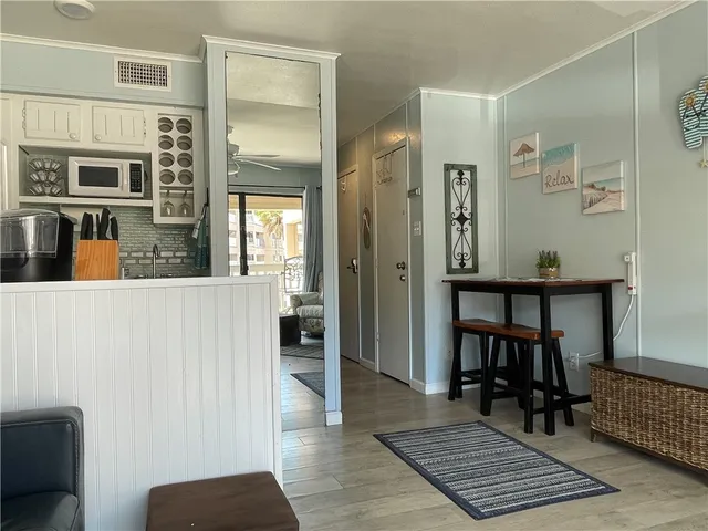 a view of a livingroom with furniture and a window