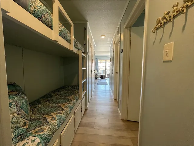 a bathroom with a glass door shower and a sink