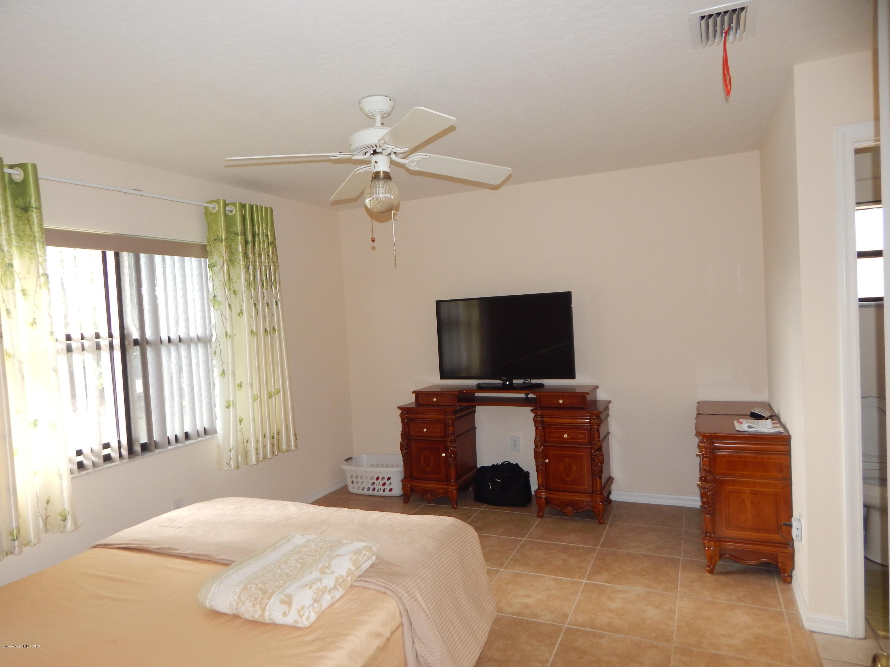1247 Winding Meadows Road Rockledge, FL 32955 - Photo 6 of 23 Master bedroom