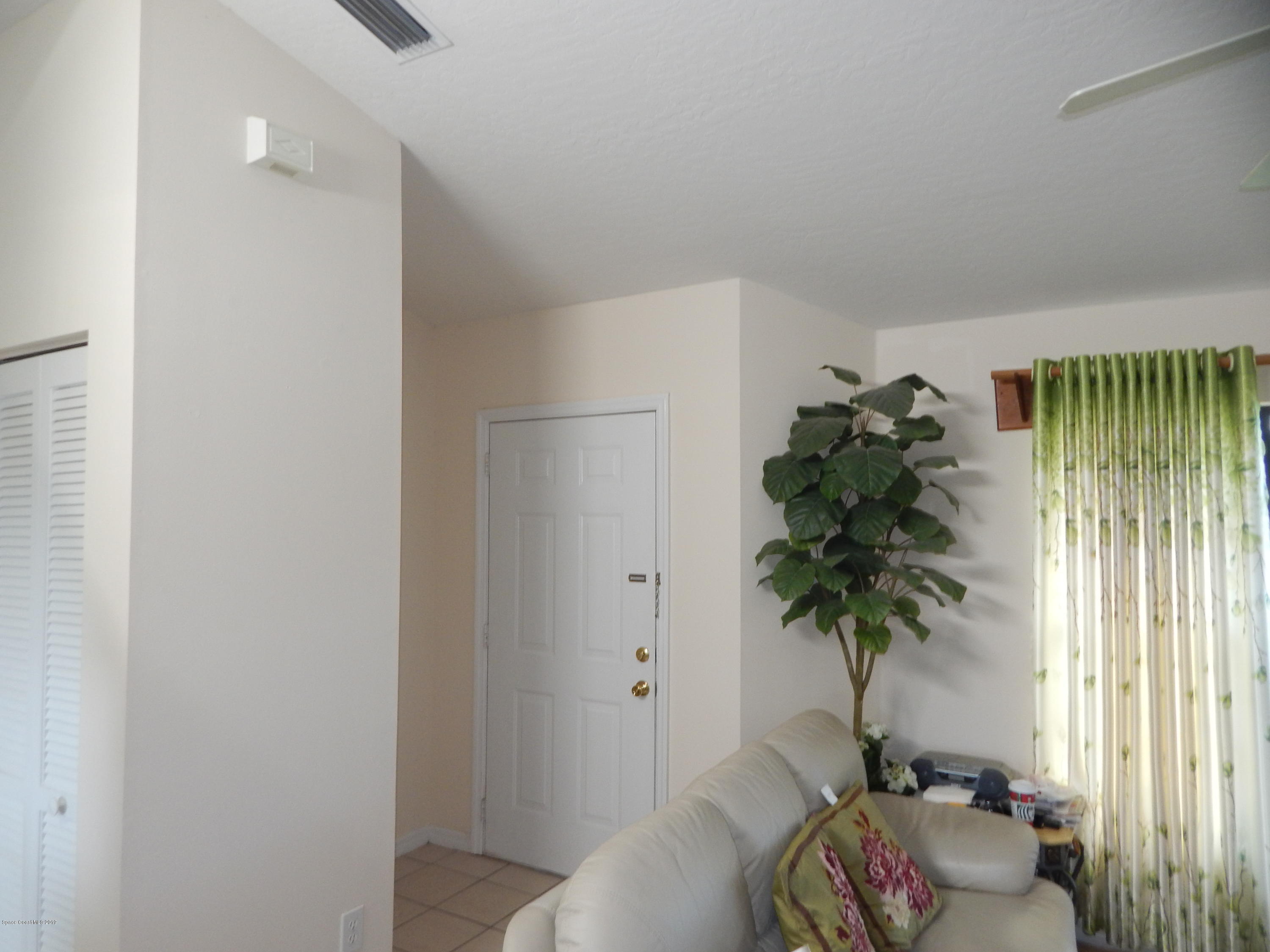 1247 Winding Meadows Road Rockledge, FL 32955 - Photo 10 of 23 Front door into family room