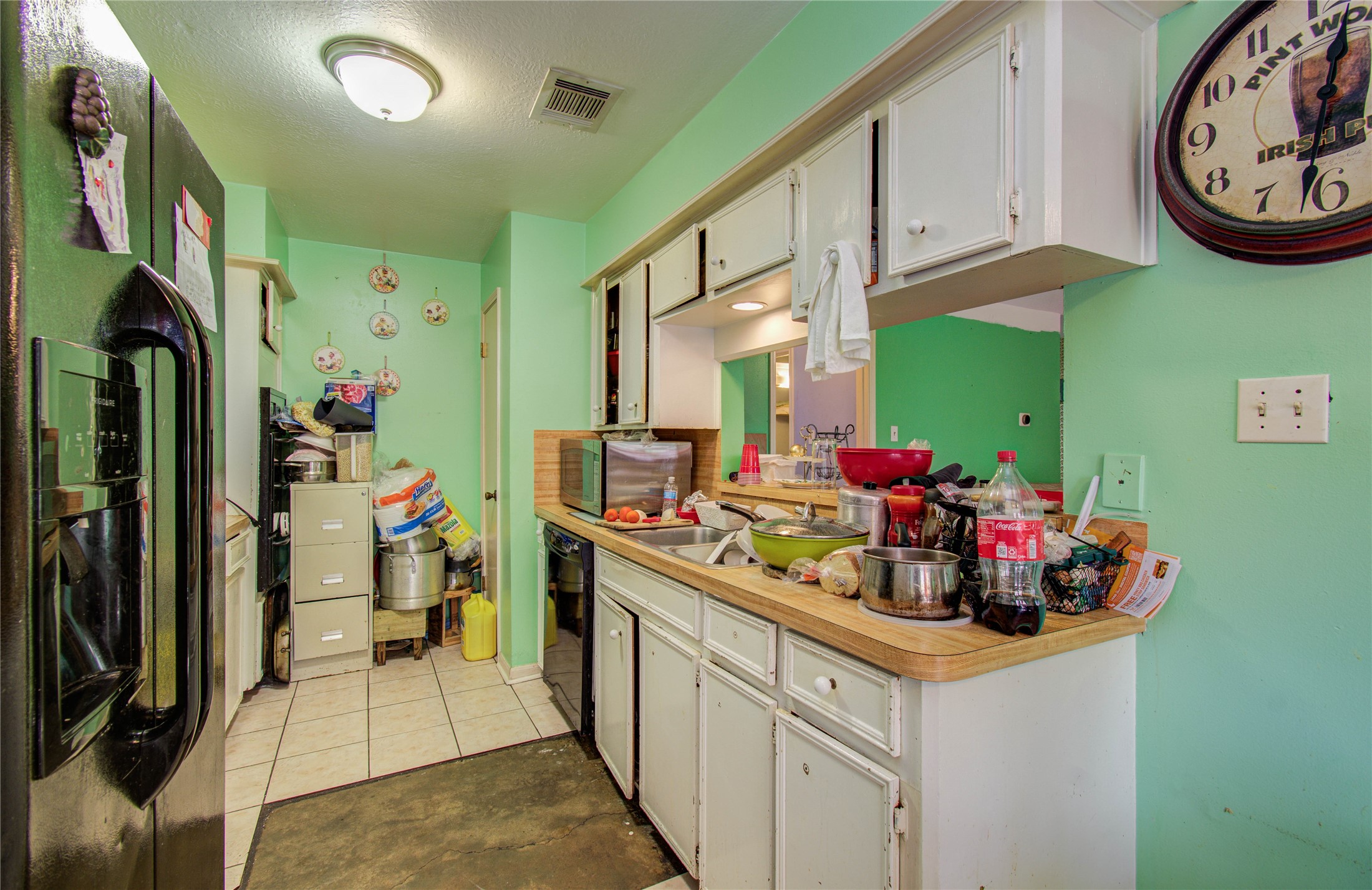 22315 Indian Ridge Drive Katy, TX 77450 - Photo 12 of 29 a kitchen with a sink and cabinets