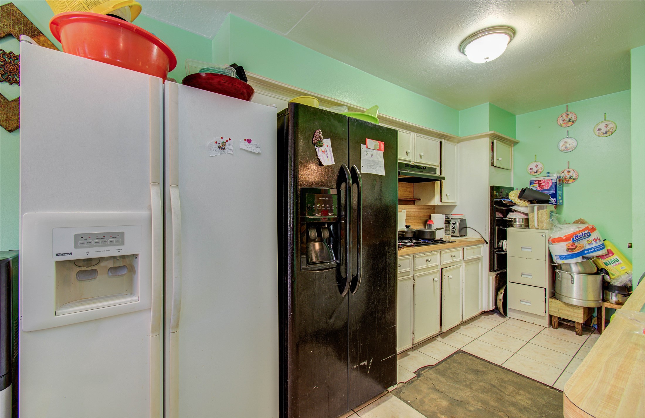 22315 Indian Ridge Drive Katy, TX 77450 - Photo 13 of 29 a kitchen with a refrigerator and sink