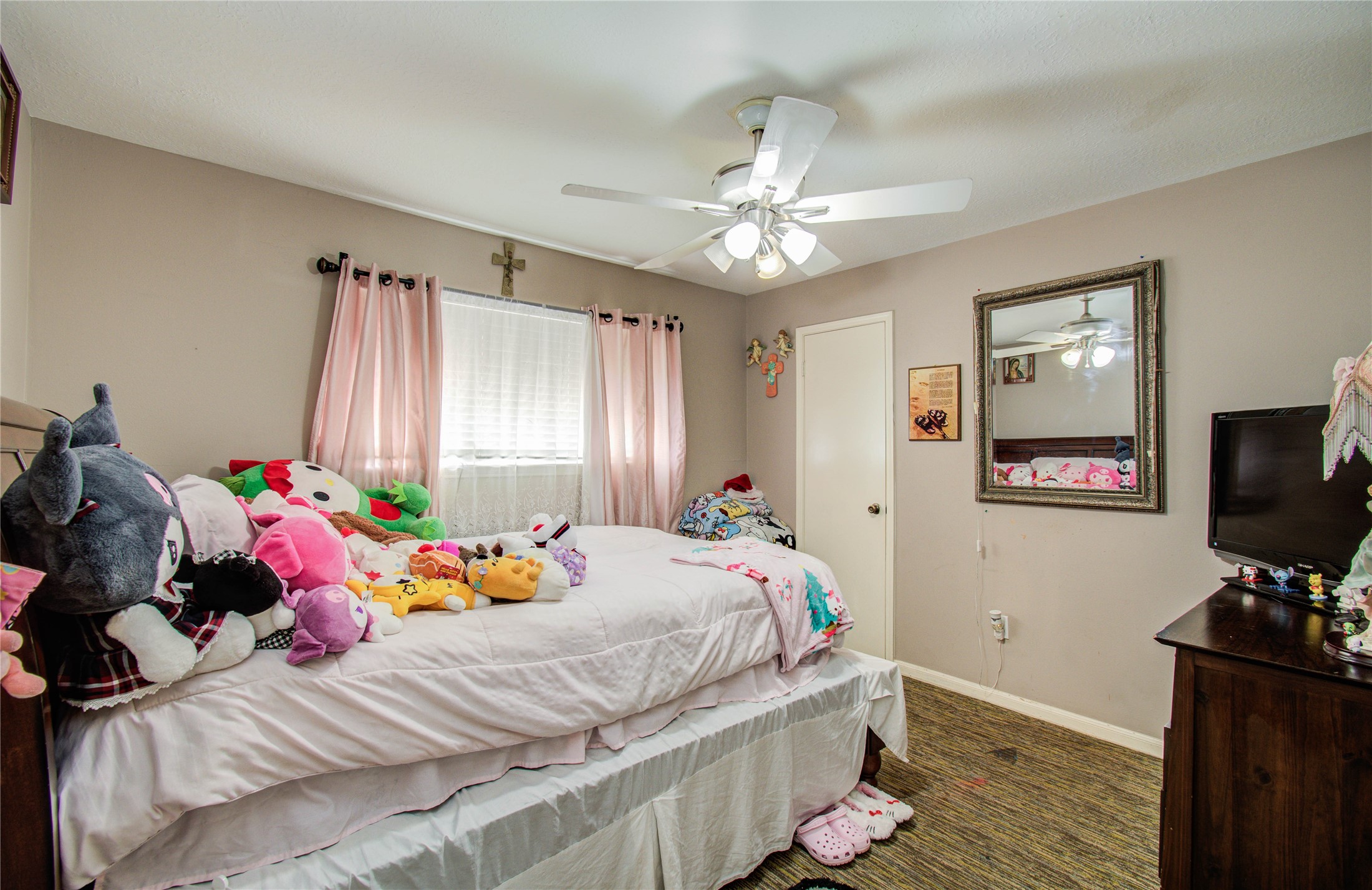22315 Indian Ridge Drive Katy, TX 77450 - Photo 23 of 29 a bedroom with a bed and a flat screen tv