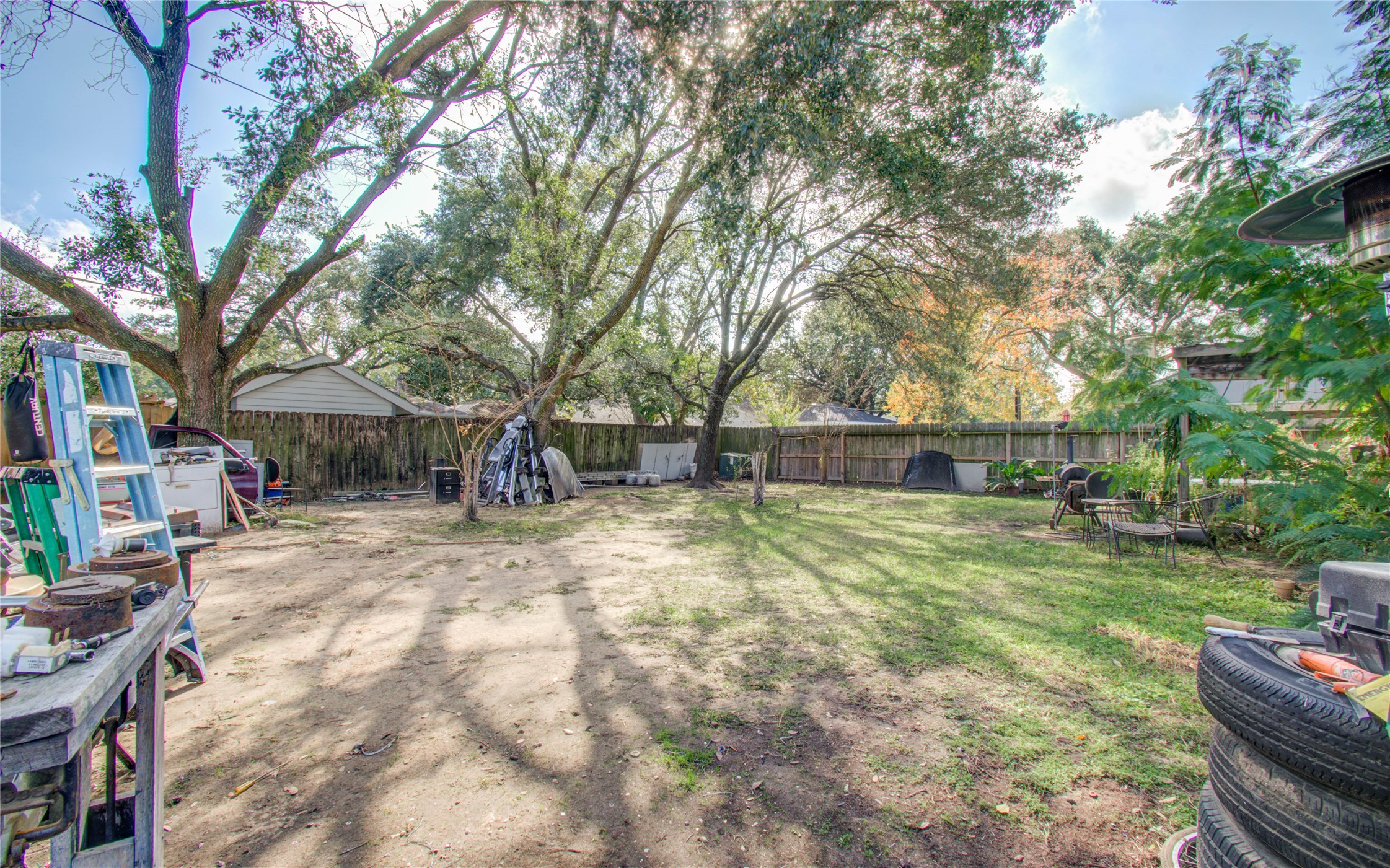 22315 Indian Ridge Drive Katy, TX 77450 - Photo 26 of 29 a backyard of a house with barbeque oven table and chairs
