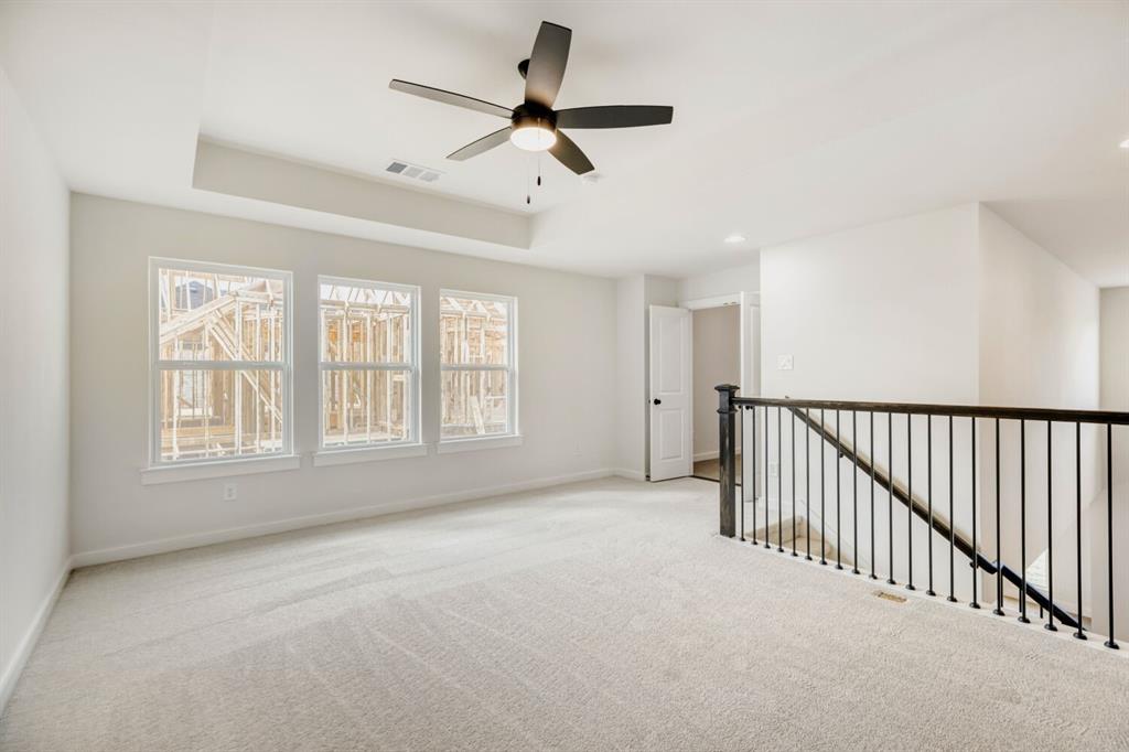 3328 Chinaberry Street Celina, TX 75009 - Photo 10 of 29 a view of a livingroom with a ceiling fan and window