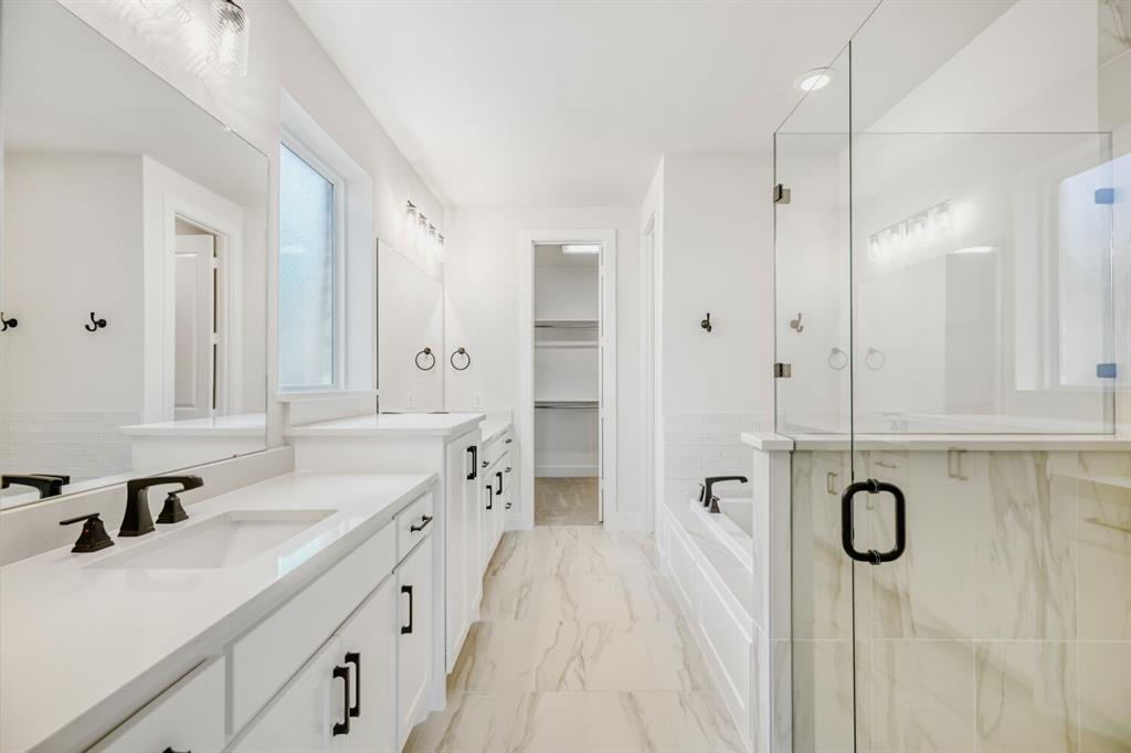 3328 Chinaberry Street Celina, TX 75009 - Photo 14 of 29 a spacious bathroom with a double vanity sink a mirror and shower