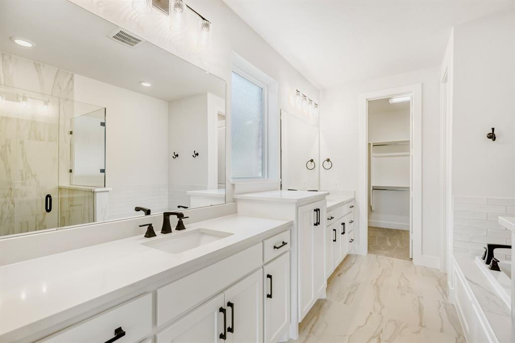 3328 Chinaberry Street Celina, TX 75009 - Photo 15 of 29 a spacious bathroom with double sink and a mirror