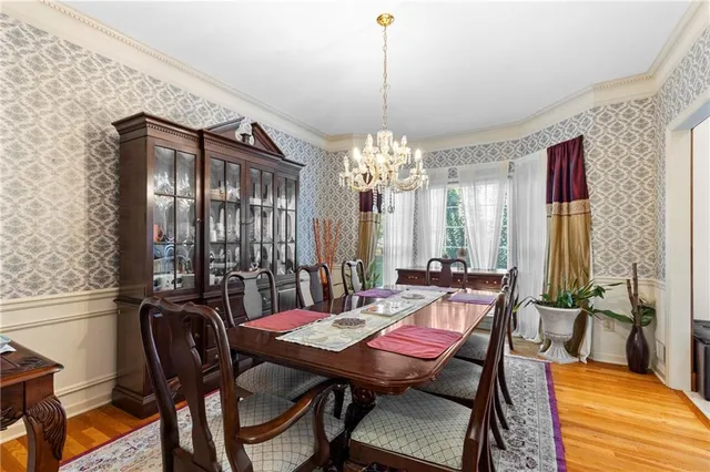 a view of a dining room with furniture and window