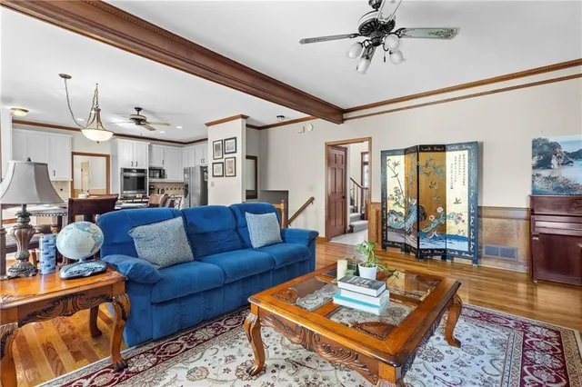 a living room with furniture and a rug