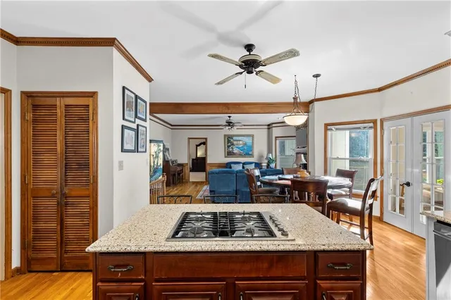 a view of living room filled with furniture and wooden floor