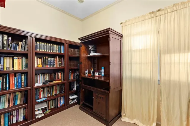 a room that has a book shelf and a window