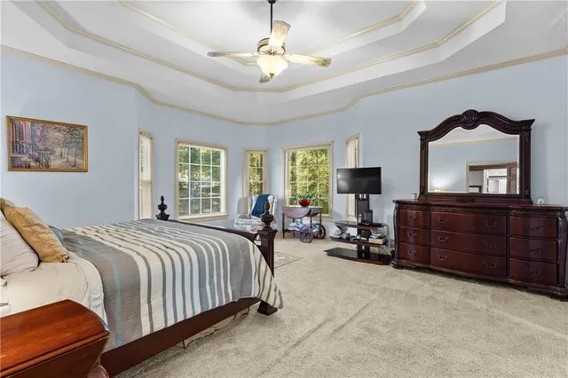 a bedroom with bed and window