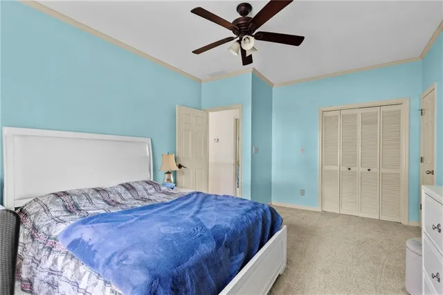 a living room with furniture gym equipment and a large window