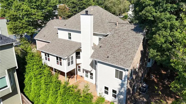 a aerial view of a house with a yard