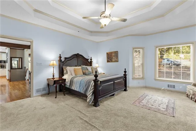 a bedroom with a bed lamps and window