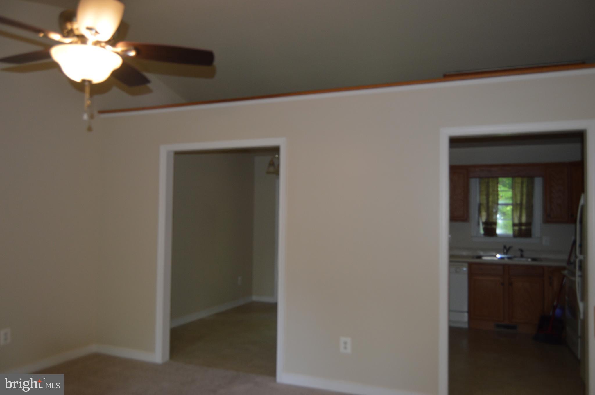 12137 Shortleaf Road Ruther Glen, VA 22546 - Photo 6 of 22 Living Room looking into Kitchen/Dining Room