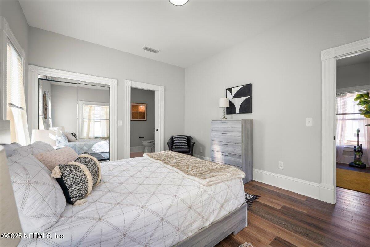 1946 Redell Street Jacksonville, FL 32206 - Photo 18 of 28 a bedroom with a bed and wooden floor
