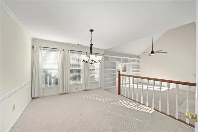 a view of a hallway with windows