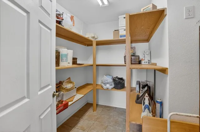 a bedroom with a bed and a television