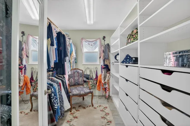 a view of a patio with a table chairs and a backyard