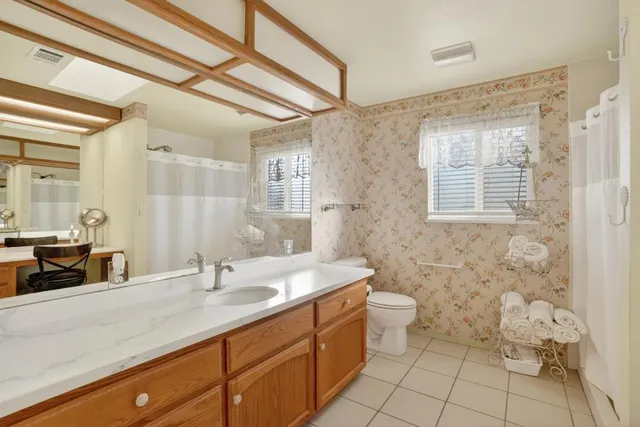 a view of a city from a dining room with furniture window and outside view