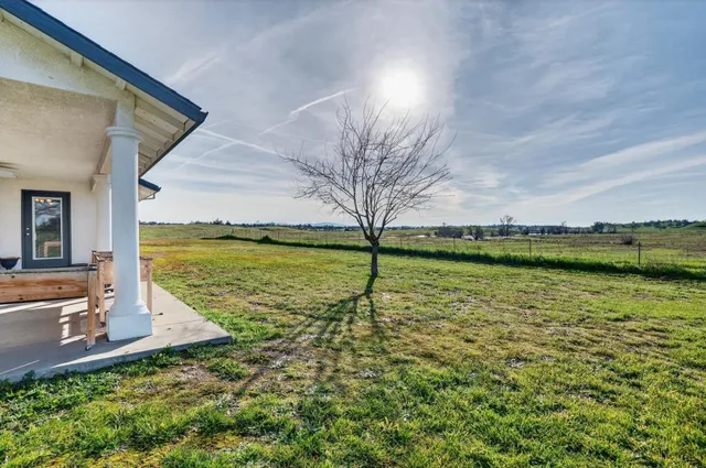 a living room with lots of furniture and clutter