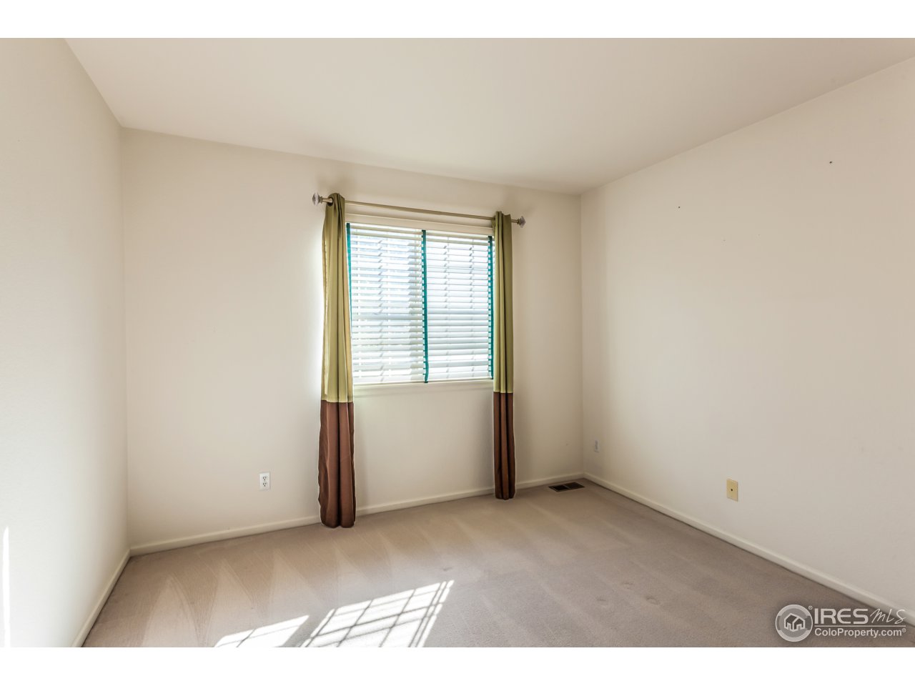 607 Rider Ridge Road Longmont, CO 80504 - Photo 25 of 30 an empty room with windows