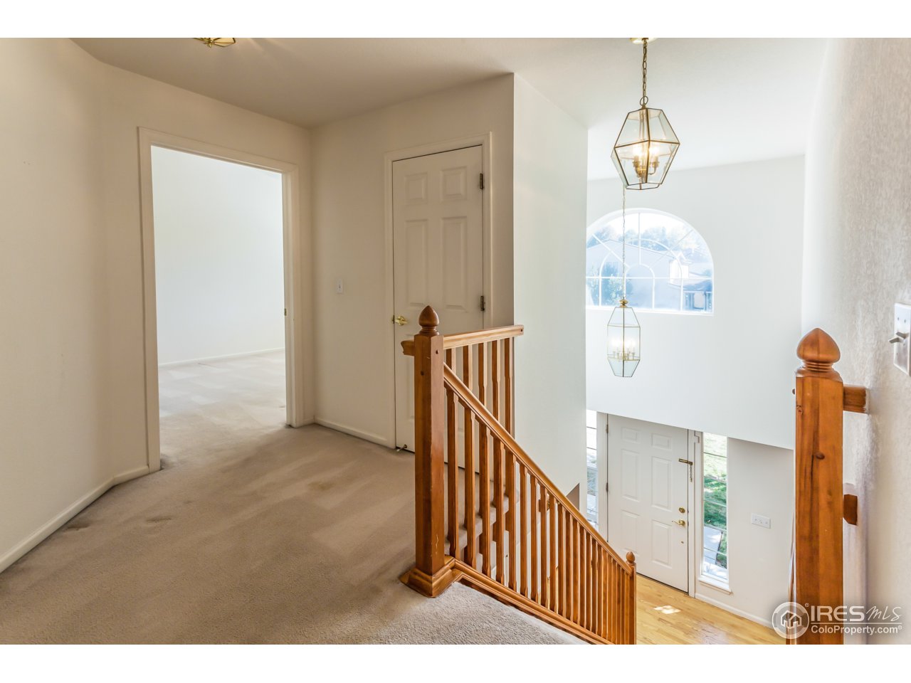 607 Rider Ridge Road Longmont, CO 80504 - Photo 27 of 30 a view of a hallway view with staircase