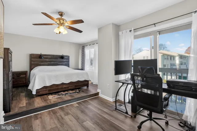 a bedroom with furniture and a window