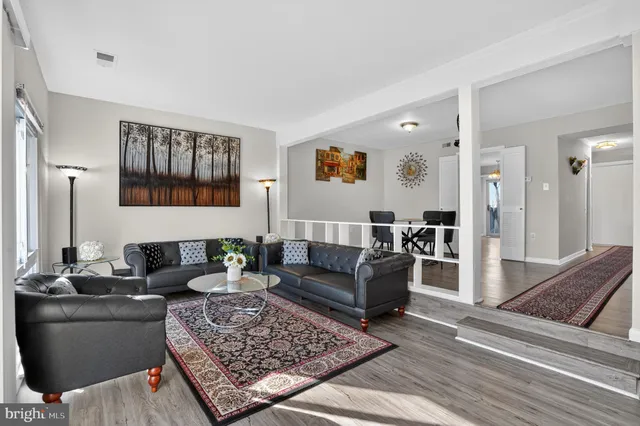 a living room with furniture and a rug