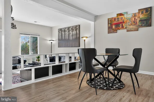 a view of a dining room with furniture and wooden floor
