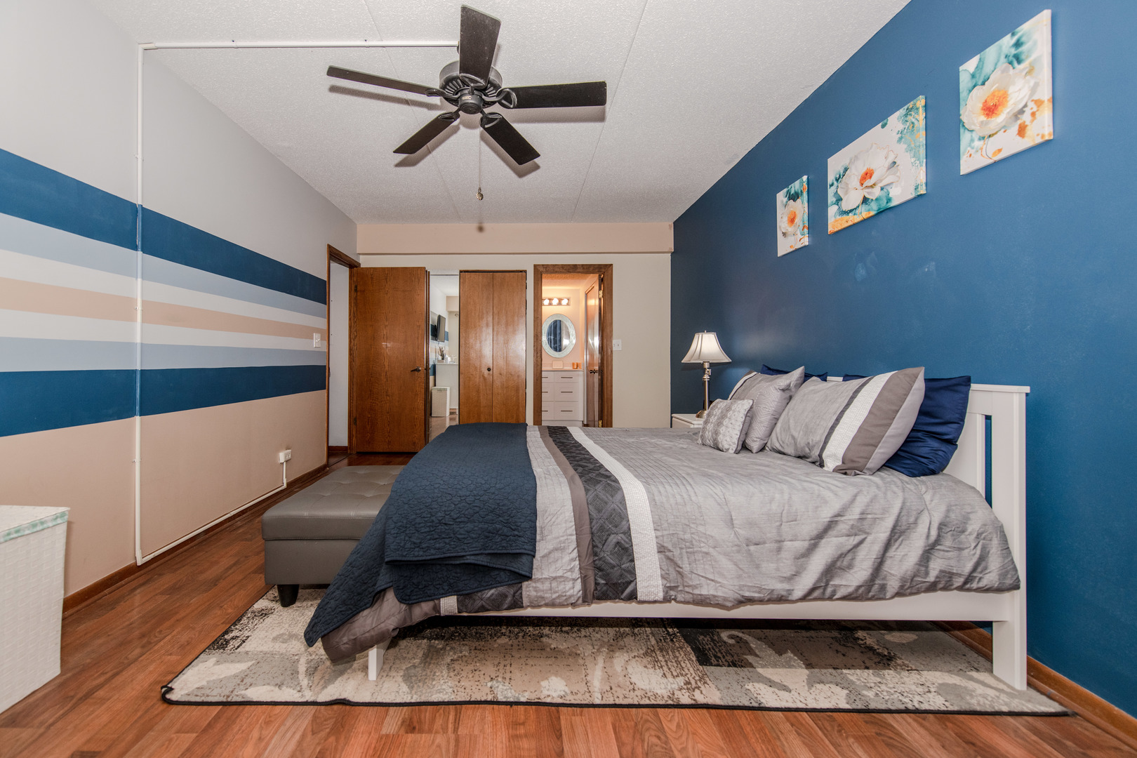 1504 Woodbridge Road, Unit 2E Joliet, IL 60436 - Photo 12 of 34 a bedroom with a bed and a chandelier