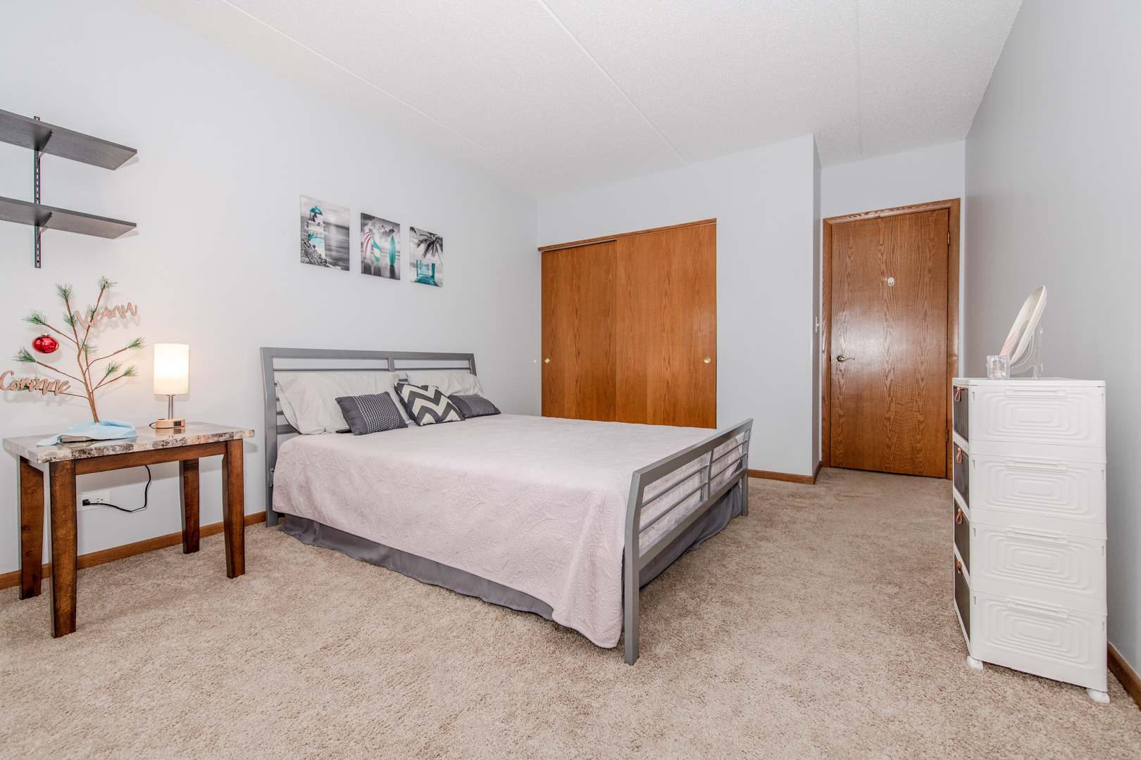1504 Woodbridge Road, Unit 2E Joliet, IL 60436 - Photo 15 of 34 a bedroom with a bed and a table in it
