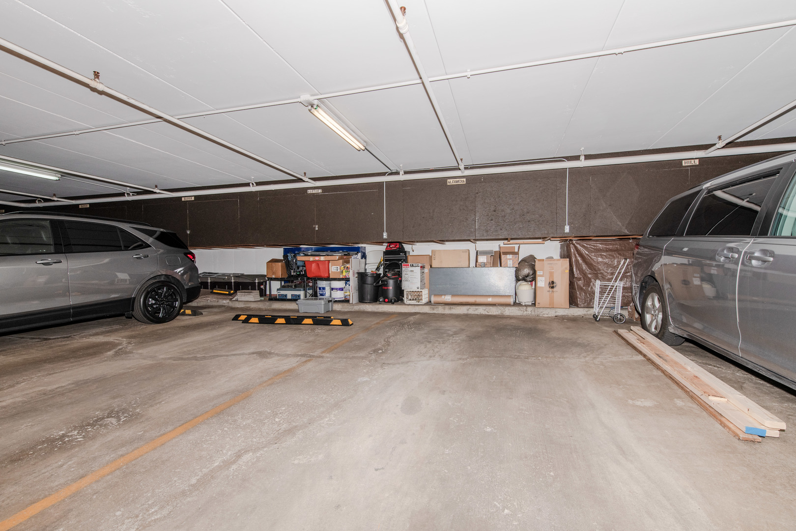 1504 Woodbridge Road, Unit 2E Joliet, IL 60436 - Photo 19 of 34 a view of parking garage with cars