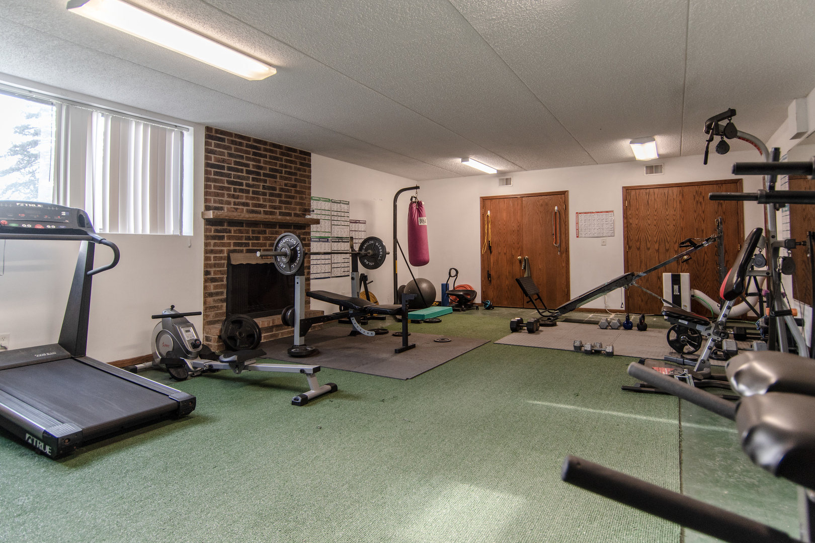 1504 Woodbridge Road, Unit 2E Joliet, IL 60436 - Photo 22 of 34 a view of a room with gym equipment