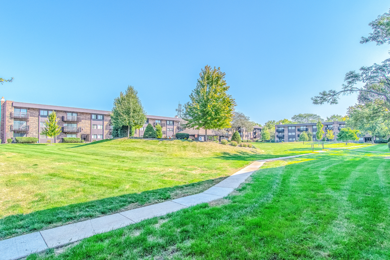1504 Woodbridge Road, Unit 2E Joliet, IL 60436 - Photo 27 of 34 a view of building with outdoor space