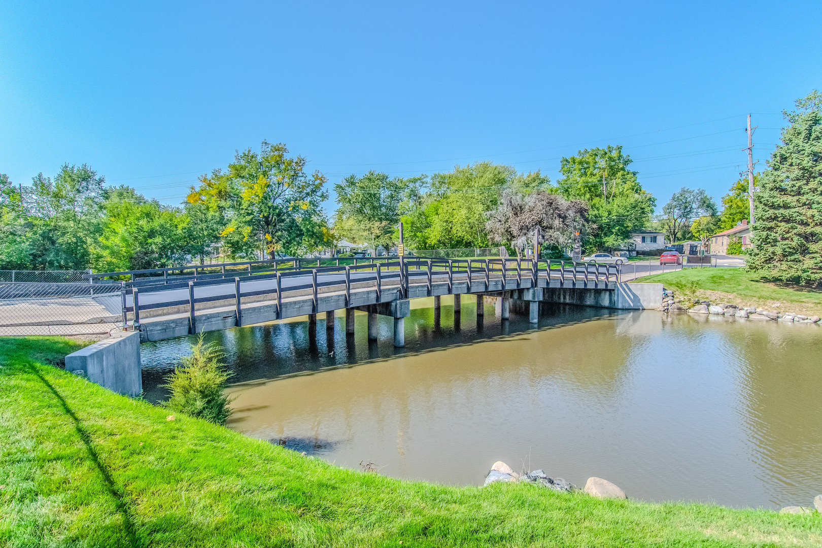 1504 Woodbridge Road, Unit 2E Joliet, IL 60436 - Photo 30 of 34 a view of a swimming pool with a garden