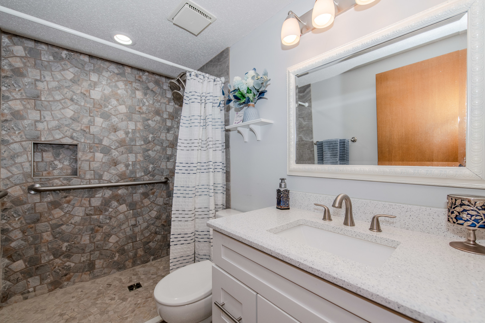 1504 Woodbridge Road, Unit 2E Joliet, IL 60436 - Photo 3 of 34 a bathroom with a sink a toilet and shower